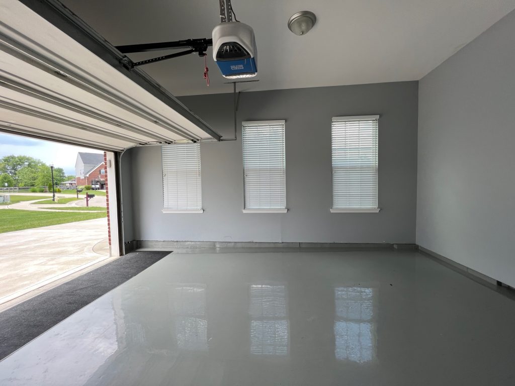 garage after white epoxy flooring and white painted walls